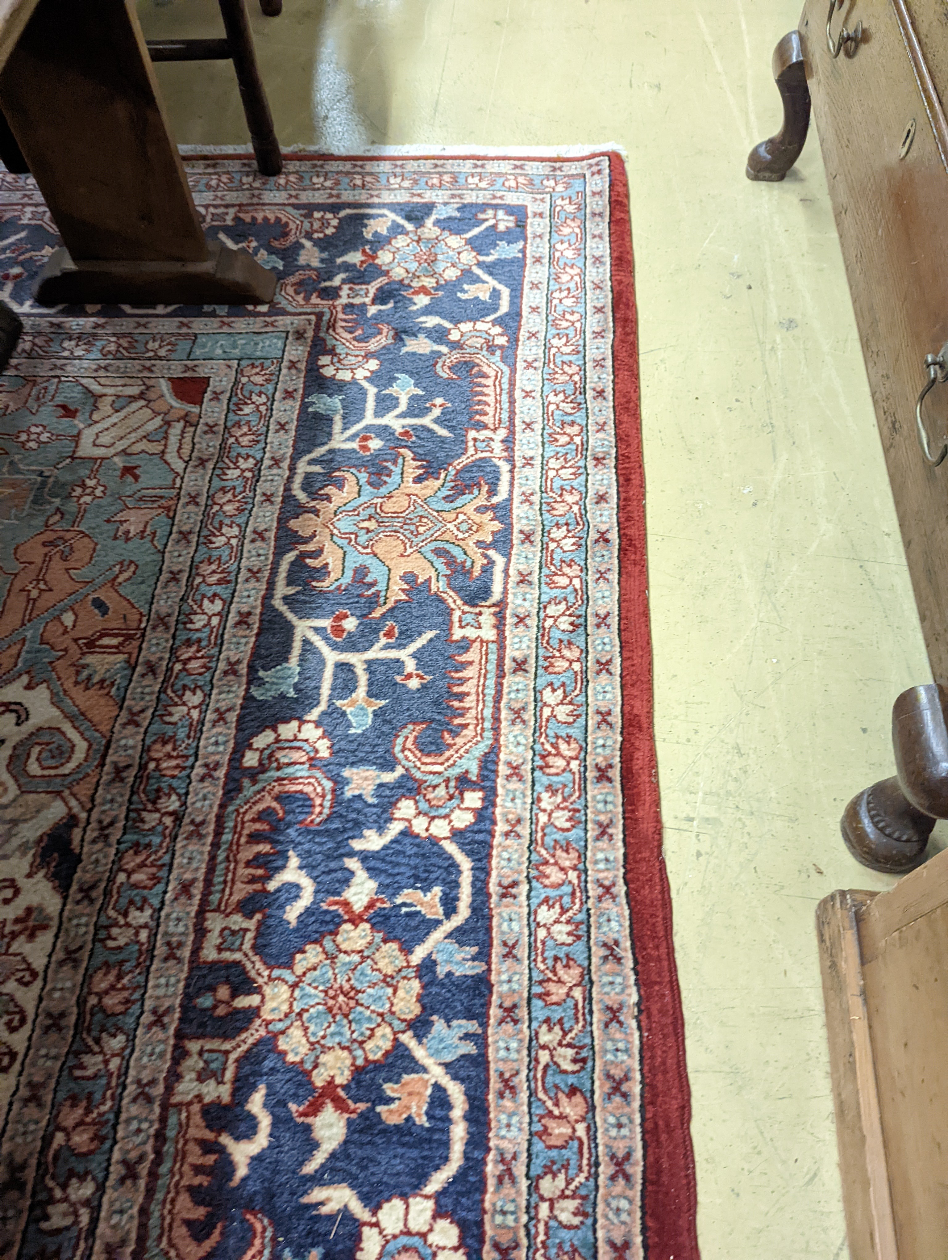 A large Caucasian style red ground carpet, 460 x 330cm